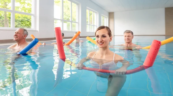 Patients during remobilization in a health center doing aquarobics — Stock Photo, Image