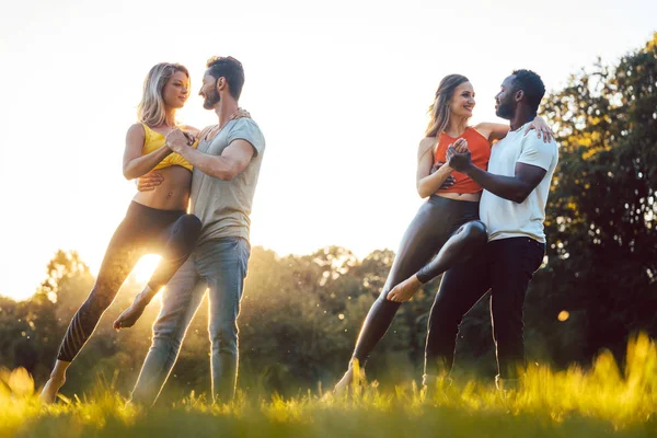 Professional dancers training outdoors