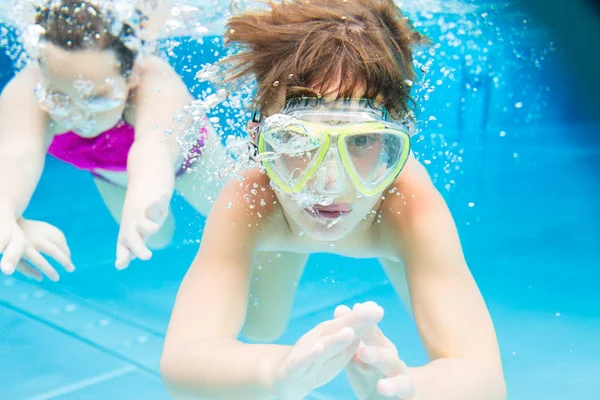 Boy swimming underwater — Stock Photo, Image