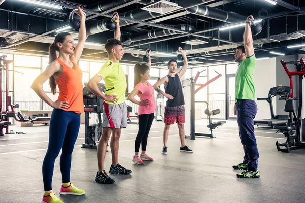 People taking training from gym trainer — Stock Photo, Image