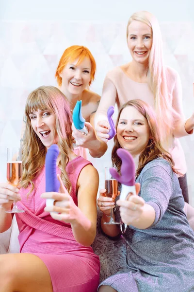 Women showing sex toys they bought at a dildo party — Stok fotoğraf