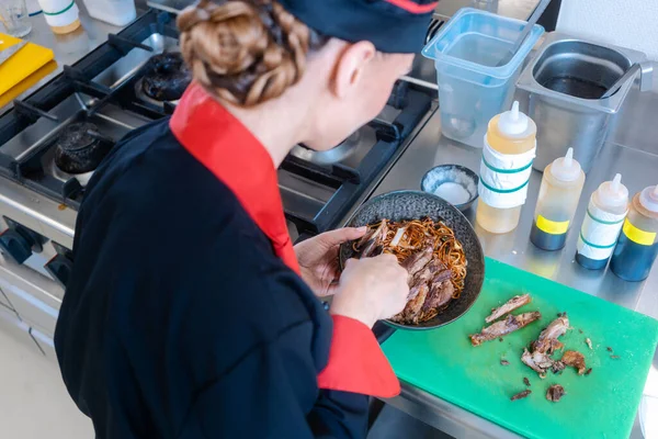 Chef stirring pasta — Stock Photo, Image