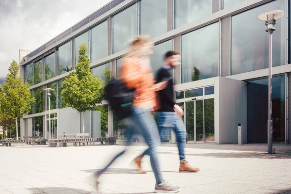 Blurred silhouette of students being busy on university campus — Stock Photo, Image
