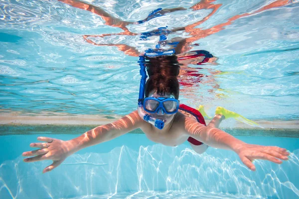 Boy in mask dive in swimming pool — Stock Photo, Image