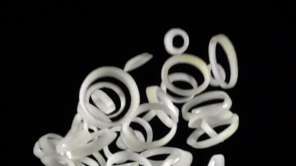 Falling rings of onion slices, slow motion — Stock Video