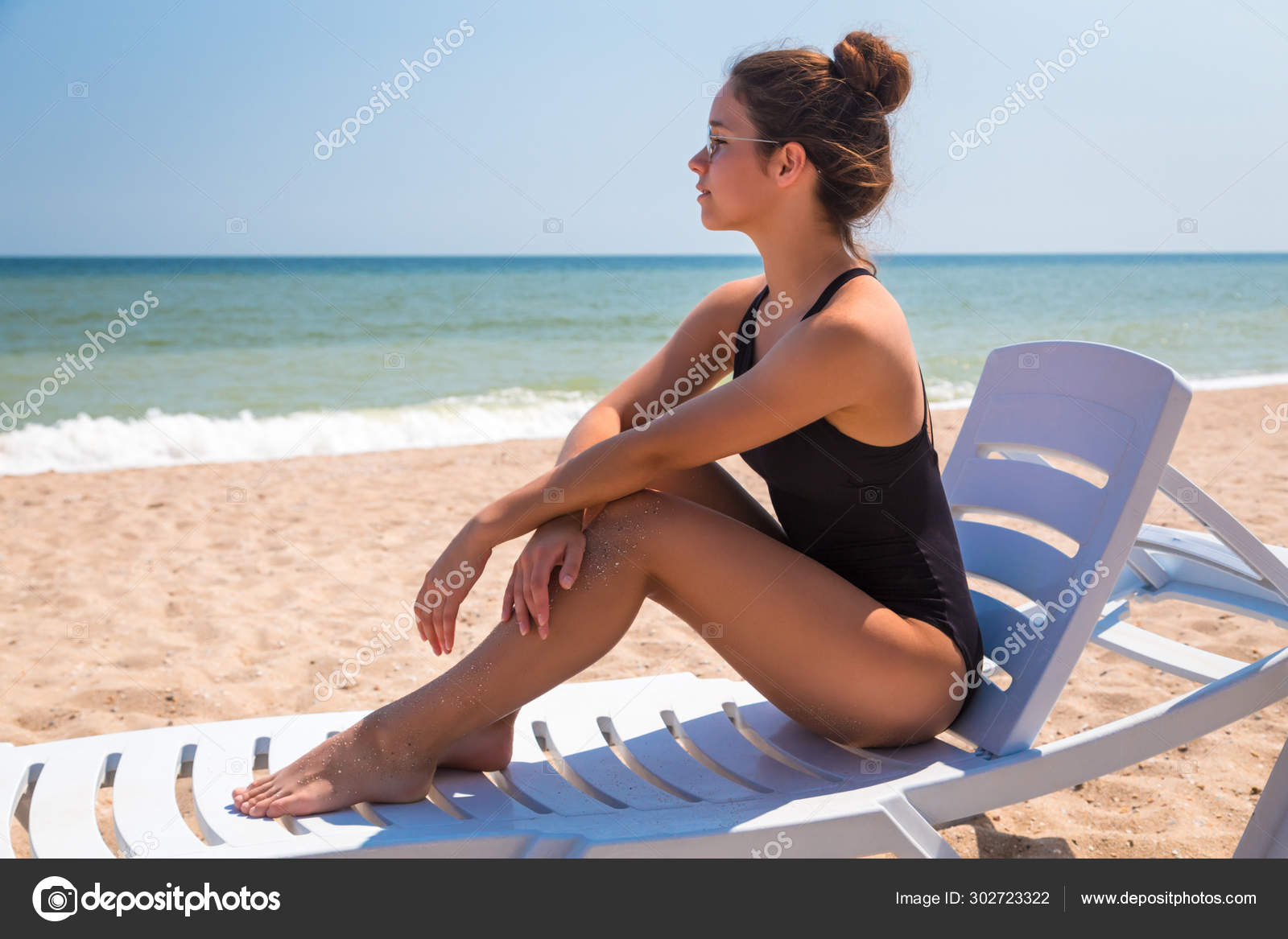 Beautiful girl lying on the beach chair Stock Photo sbworld7 302723322