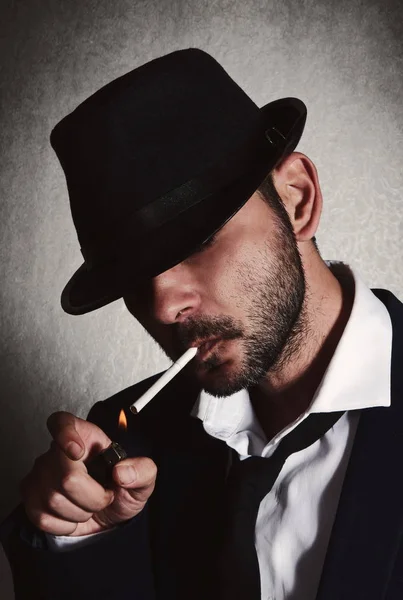 Retro man with the hat and cigarette