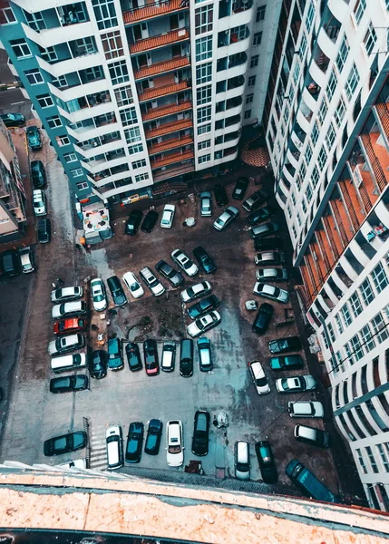 Apartment building closeup with messy car parking. Batumi.Georgia