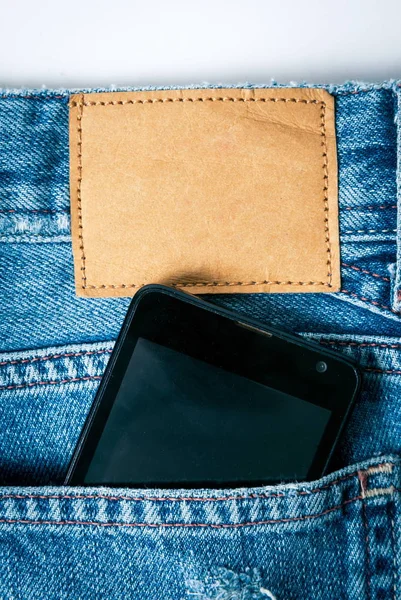 Phone in the jeans pocket