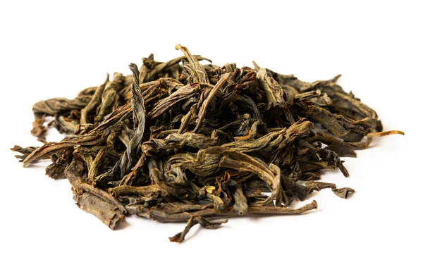 Dry tea leaves on the white — Stock Photo, Image