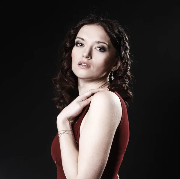 Portrait of beautiful woman in red dress posing for the camera — Stock Photo, Image