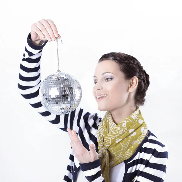 Pretty young woman holding a mirror ball. — Stock Photo, Image