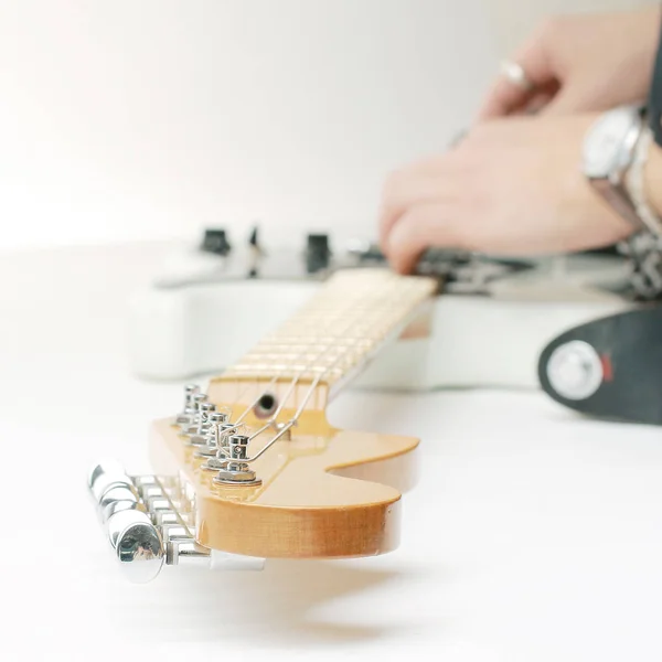 closeup.electric guitar with metal strap. isolated on white.