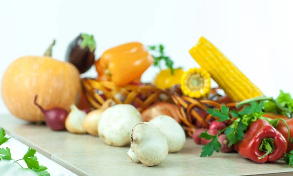 Mushrooms on a background of fresh vegetables. — Stock Photo, Image