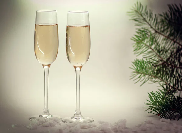 Two glasses with champagne on Christmas background — Stock Photo, Image