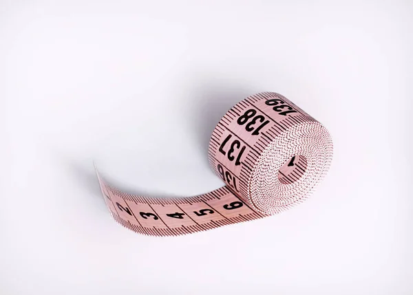 Tape-meter. Isolated on a purple background — Stock Photo, Image