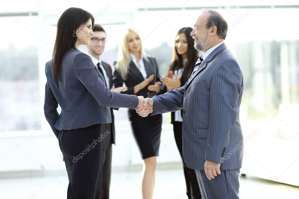 handshake of a businessman and business woman