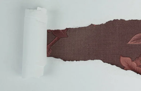 Torn sheet of paper in beautiful fabrics. — Stock Photo, Image