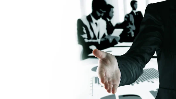 Hand for a handshake. Closing the deal against the background of the working team — Stock Photo, Image