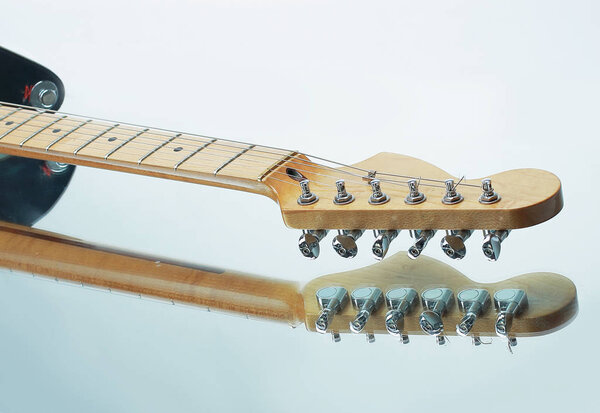 Closeup.the fretboard of an acoustic guitar isolated on white background.