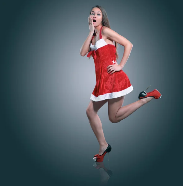 Young female model dressed as Santa Claus posing for the camera. — Stock Photo, Image