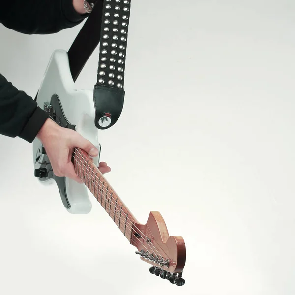 Close-up. modern electric guitar in the hands of the guitarist . — Stock Photo, Image