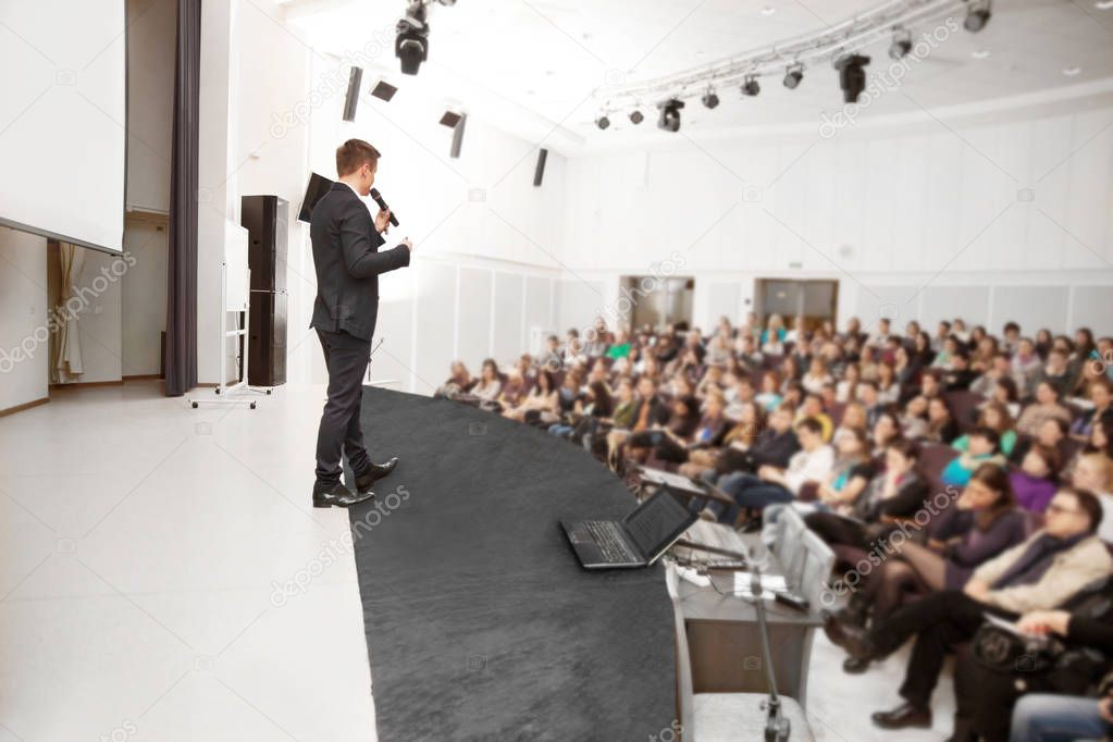 Speaker at a business conference and presentation.