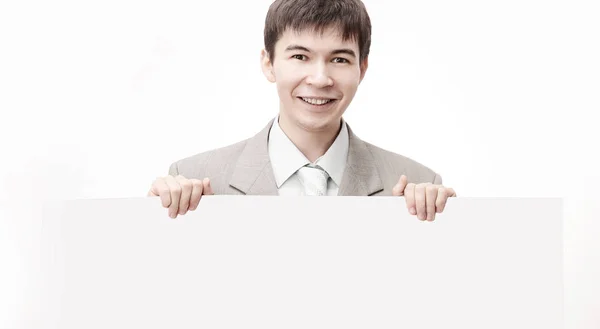 Executivo bonito homem de negócios mostrando banner em branco — Fotografia de Stock