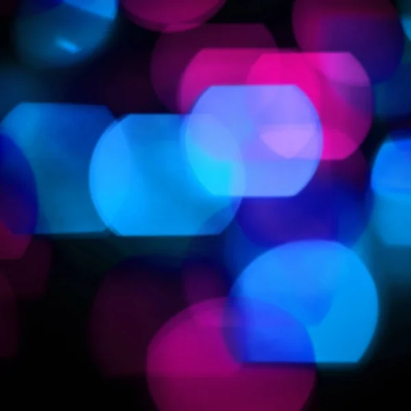 Festive background.blurred colored lights on a black background — Stock Photo, Image