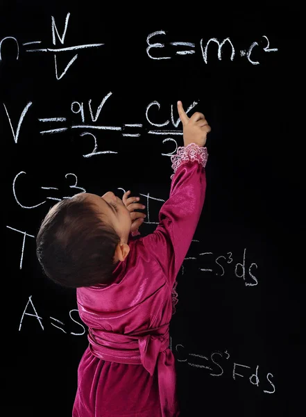 Little Gypsy boy in national costume standing near school blackboard — Stock Photo, Image