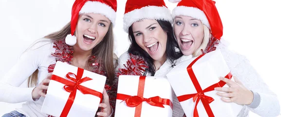 Closeup.Three młode kobiety w kapeluszach Świętego Mikołaja z Boże Narodzenie — Zdjęcie stockowe