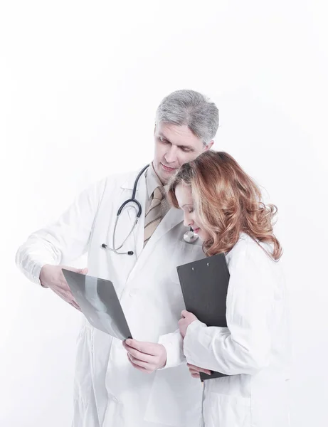 Professional medical team with doctors and surgeon examining patients x-ray image — Stock Photo, Image