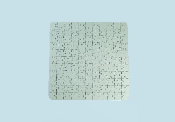 Fecha. cartão branco cinzento recolhido a partir de peças de quebra-cabeça — Fotografia de Stock