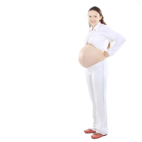 In piena crescita.donna incinta sorridente.isolata su bianco — Foto Stock