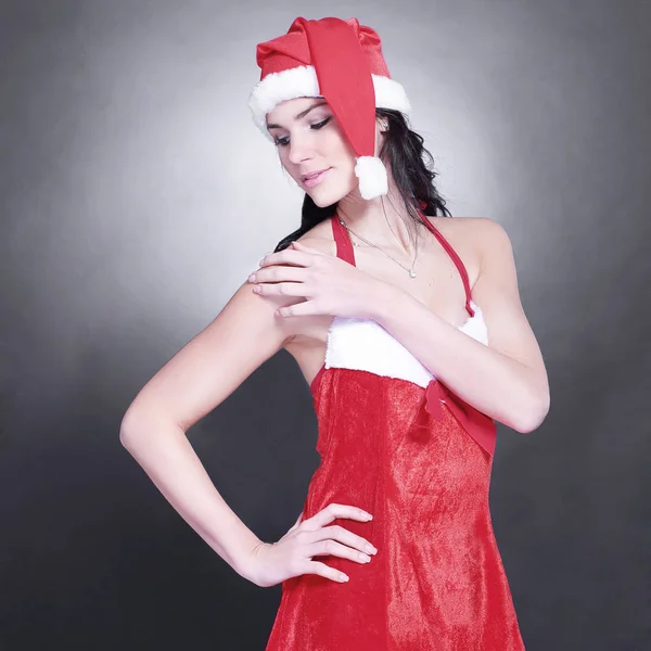 Jovem mulher surpreso vestido como Papai Noel — Fotografia de Stock