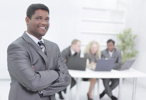 Successful young businessman on background of office — Stock Photo, Image
