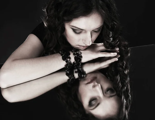 Glamorous beautiful woman looking at her reflection. — Stock Photo, Image