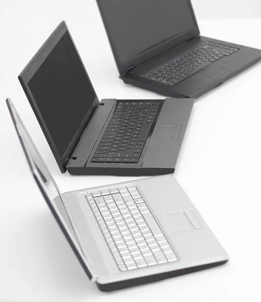 Open laptop on the desktop in an empty office — Stock Photo, Image