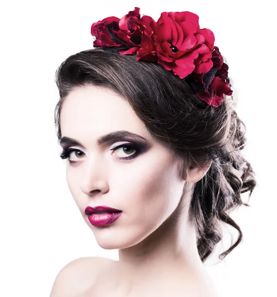 Portrait of a young woman with a red barrette in her hair — Stock Photo, Image