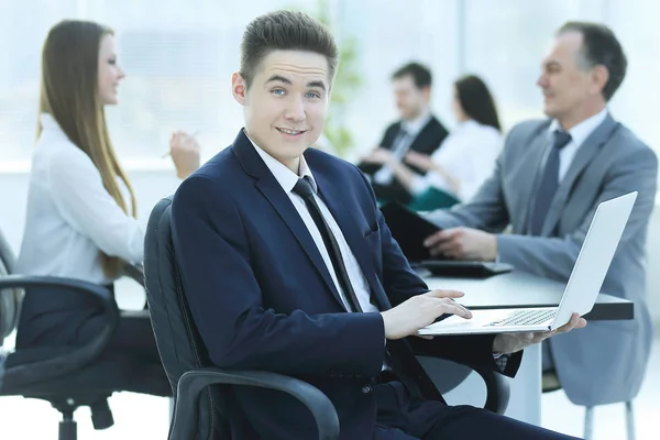 Portrait of handsome young business man and laptop — Stock Photo, Image
