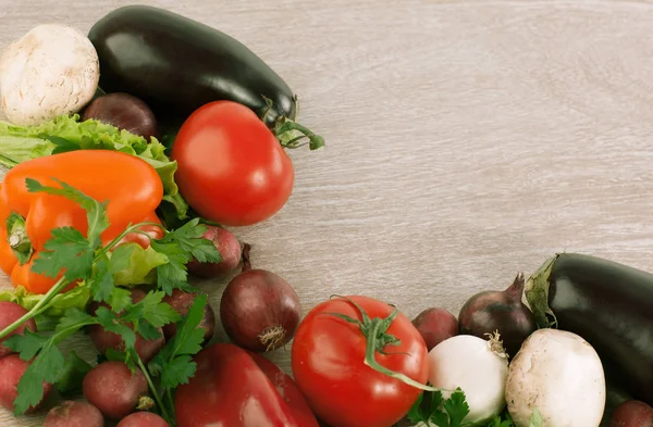 Frame made of vegetables on wooden background. — Stock Photo, Image