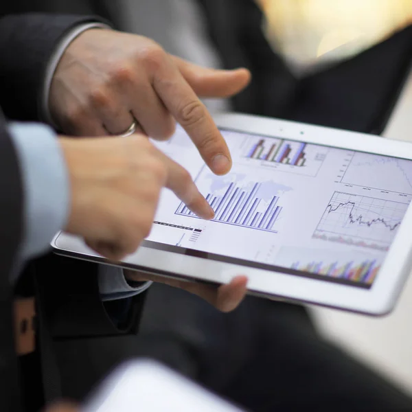 Hands of people working with tablet computer. Technology