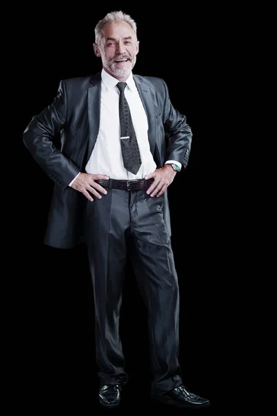 Confident businessman isolated on a dark background. — Stock Photo, Image