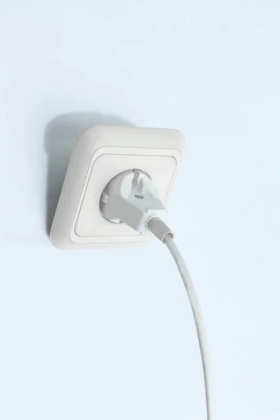 Plug into an electrical outlet.isolated on a white background. — Stock Photo, Image