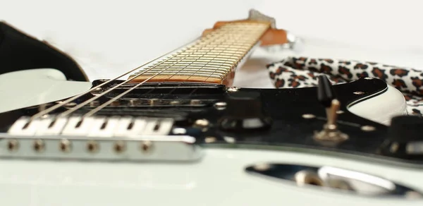 White guitar neck on grey background — Stock Photo, Image