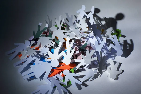 Lot of paper men piled in a heap — Stock Photo, Image