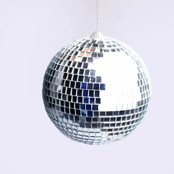 Close up .hand holding a mirror ball.isolated on gray background — стоковое фото