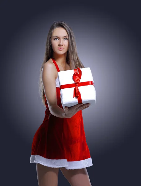 Stylish young woman in costume of Santa Claus with Christmas gi — Stock Photo, Image