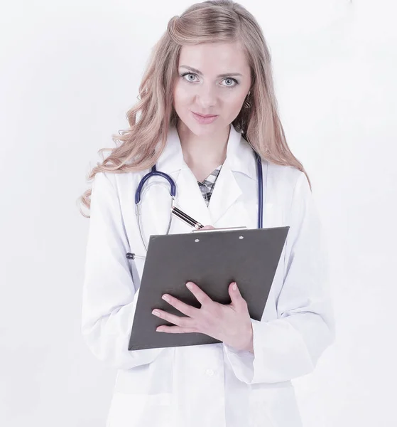 Attentive female doctor writes a prescription .isolated on white — Stock Photo, Image