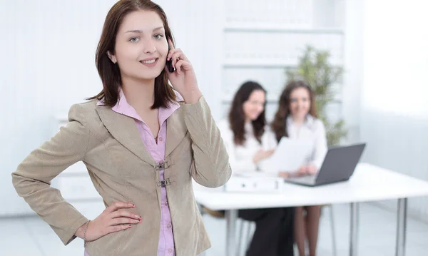 Young employee on the phone in the office — Stock Photo, Image